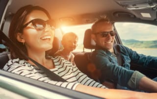 Photo of a Family on a Road Trip. Safe Travel in the USA is Possible through Elite!