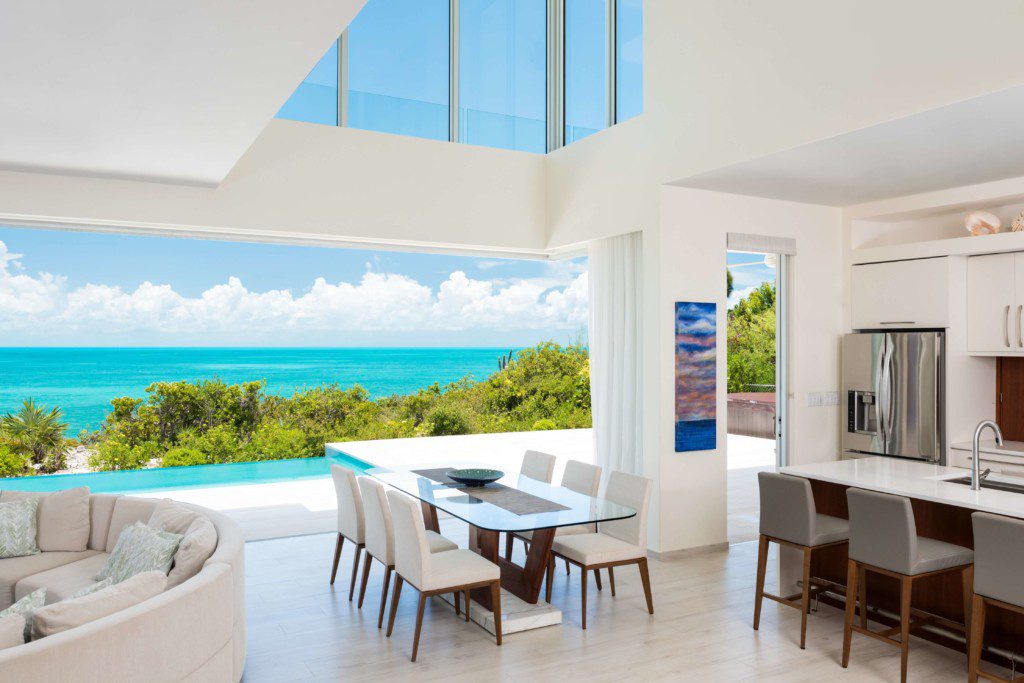One of the Turks And Caicos vacation rentals from the inside. This is the kitchen looking out onto the ocean during the day.