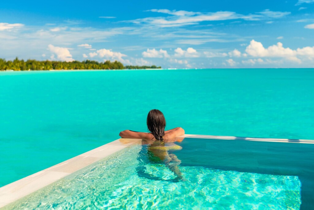 A woman in a pool enjoying one of the many Things To Do Turks And Caicos.