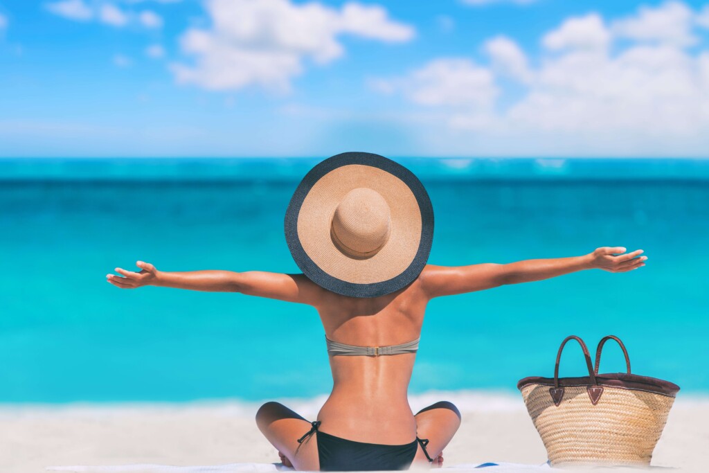 A woman enjoying Beaches In Turks And Caicos.